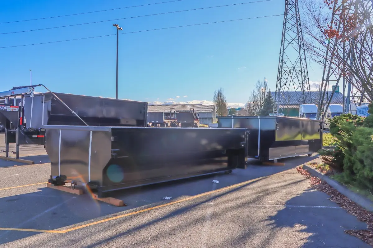 Roll-off dumpster ready for waste disposal at job site for Demolition Dumpster Rental in Walworth